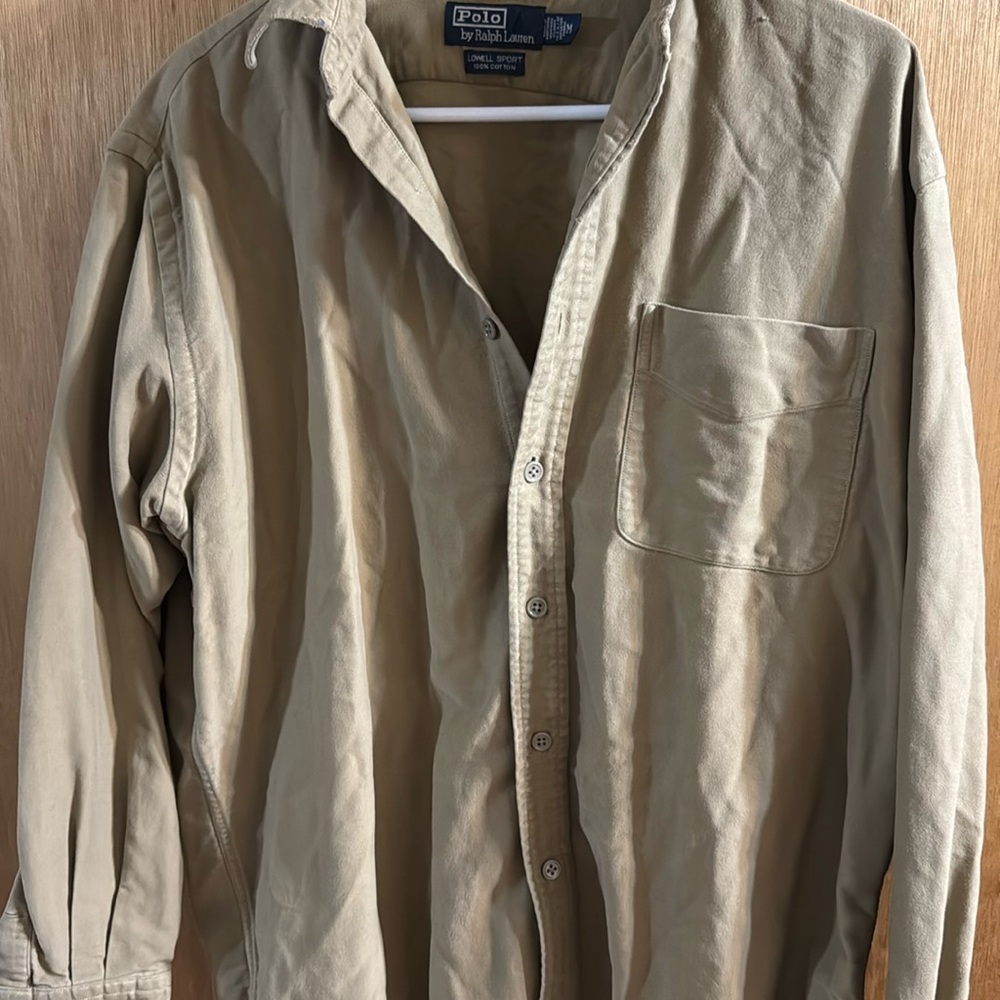 This is a polo by rock Lauren medium button up shirt